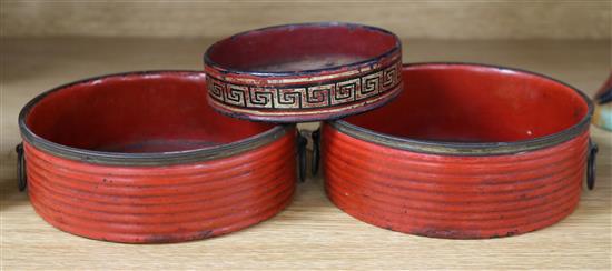 A pair of Regency papier mache wine coasters, 14cm and a similar later coaster